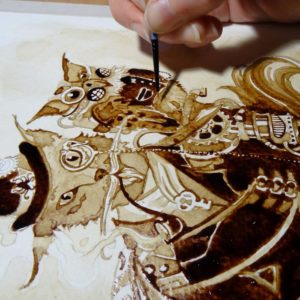 Художница рисует картины при помощи кофе